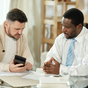Adult man with adviser accounting house price