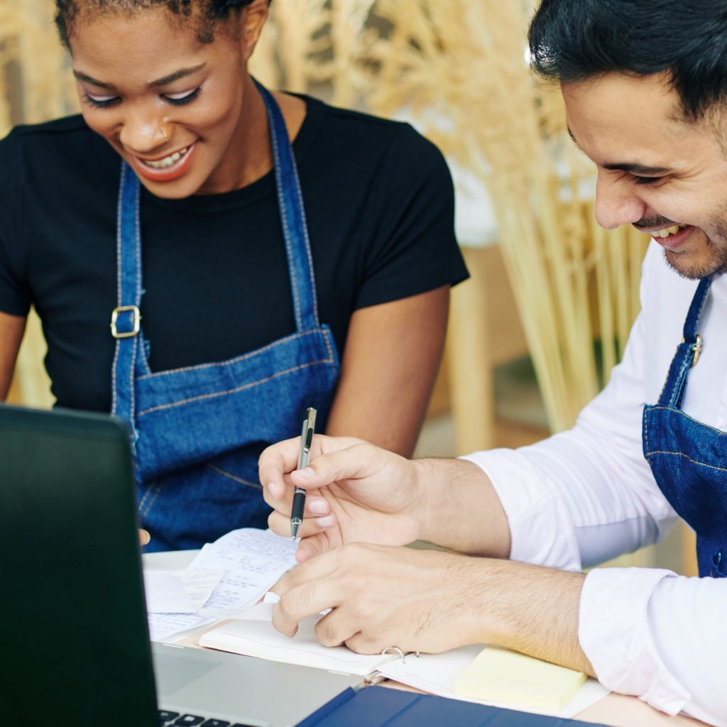 Cafe owners checking bills